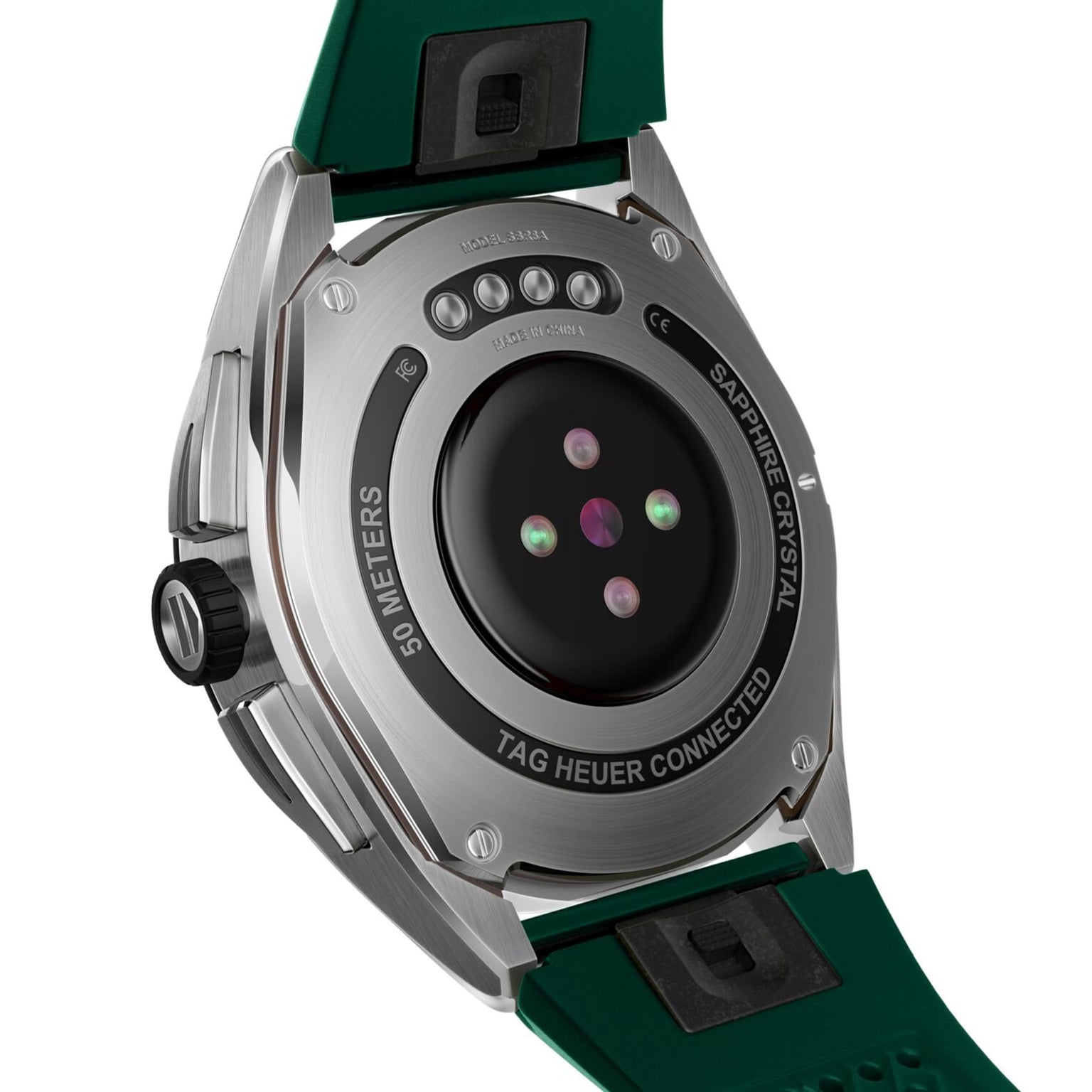 Back of a TAG Heuer Connected Calibre E4 smartwatch with green strap, sensors, and 50 meters water resistance engraved.