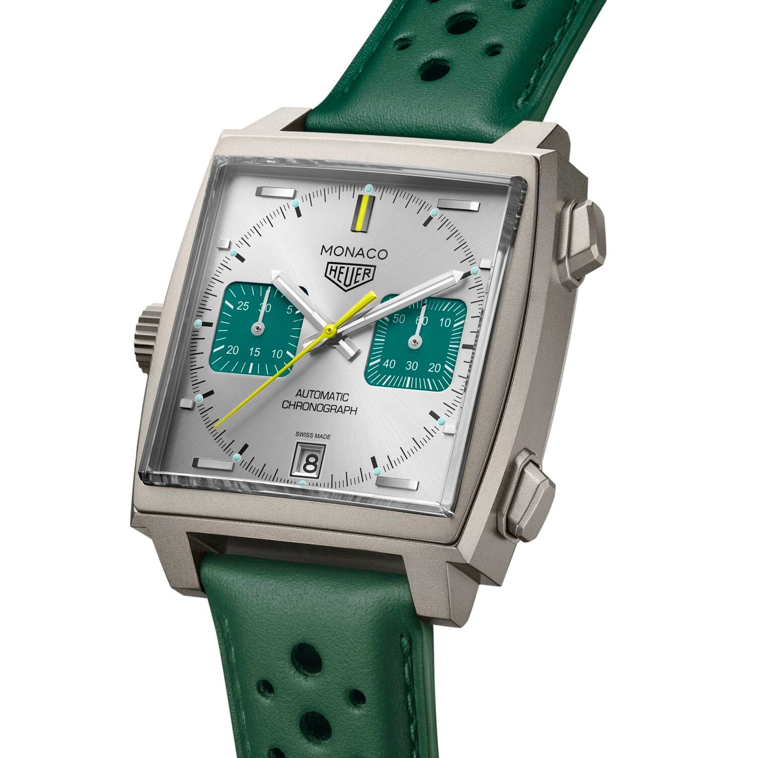 TAG Heuer Monaco Chronograph Racing Green features a square case, Racing Green and white dial, yellow second hand, Calibre 11 movement, date at 6 o’clock, and green perforated leather strap.