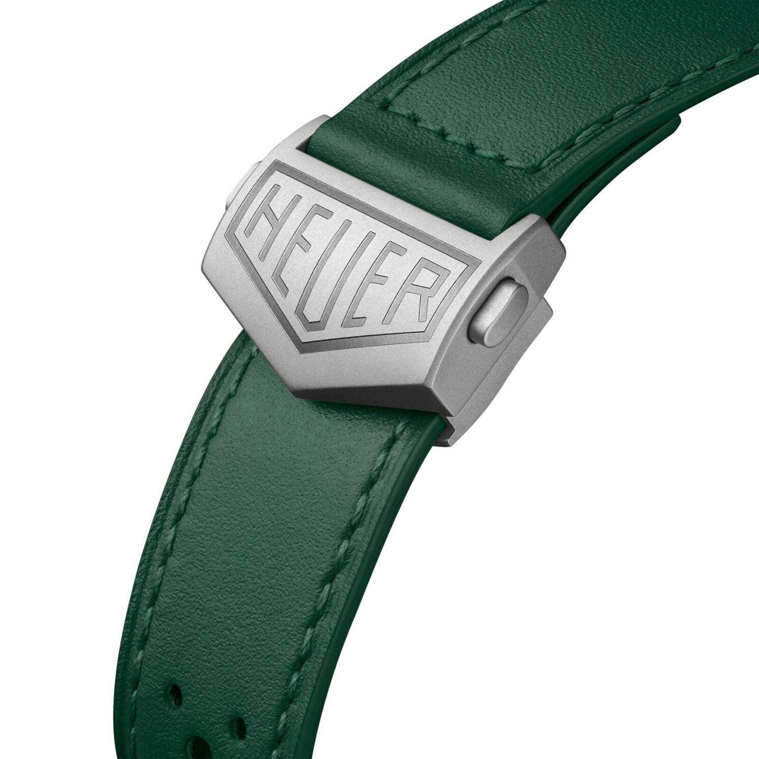 Close-up of a Racing Green leather watch strap with a silver clasp engraved “HEUER,” designed to pair perfectly with the TAG Heuer Monaco Chronograph Racing Green.