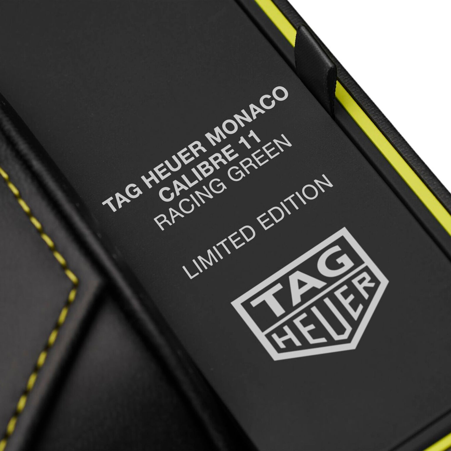 Close-up of a box featuring the TAG Heuer logo and the text Monaco Chronograph Racing Green.
