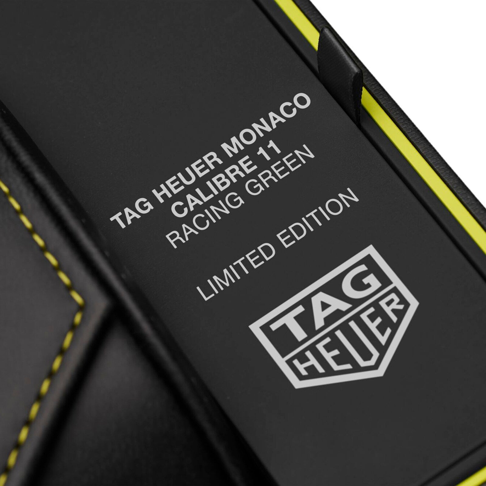 Close-up of a box featuring the TAG Heuer logo and the text Monaco Chronograph Racing Green.