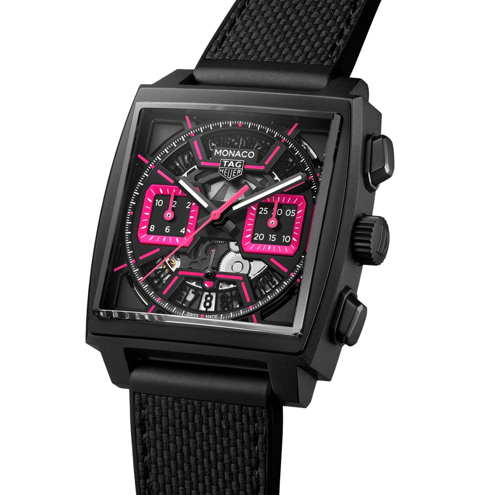 A TAG Heuer Monaco Chronograph wristwatch with a square titanium case, pink accents, black strap, and multiple subdials is shown at an angle to highlight its details.