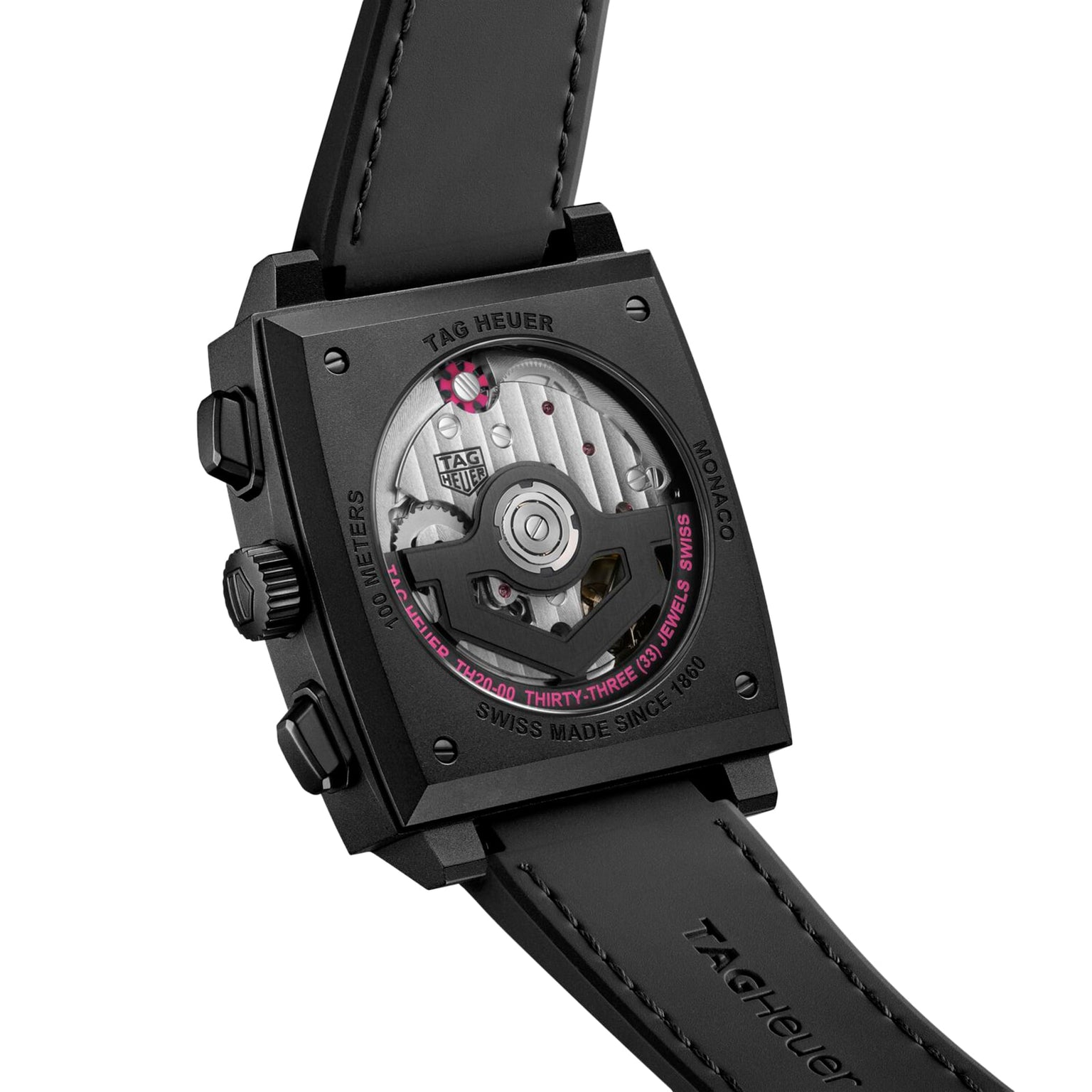 Back view of the TAG Heuer Monaco Chronograph, featuring a square titanium case, transparent caseback revealing the automatic movement, and paired with a black leather strap.