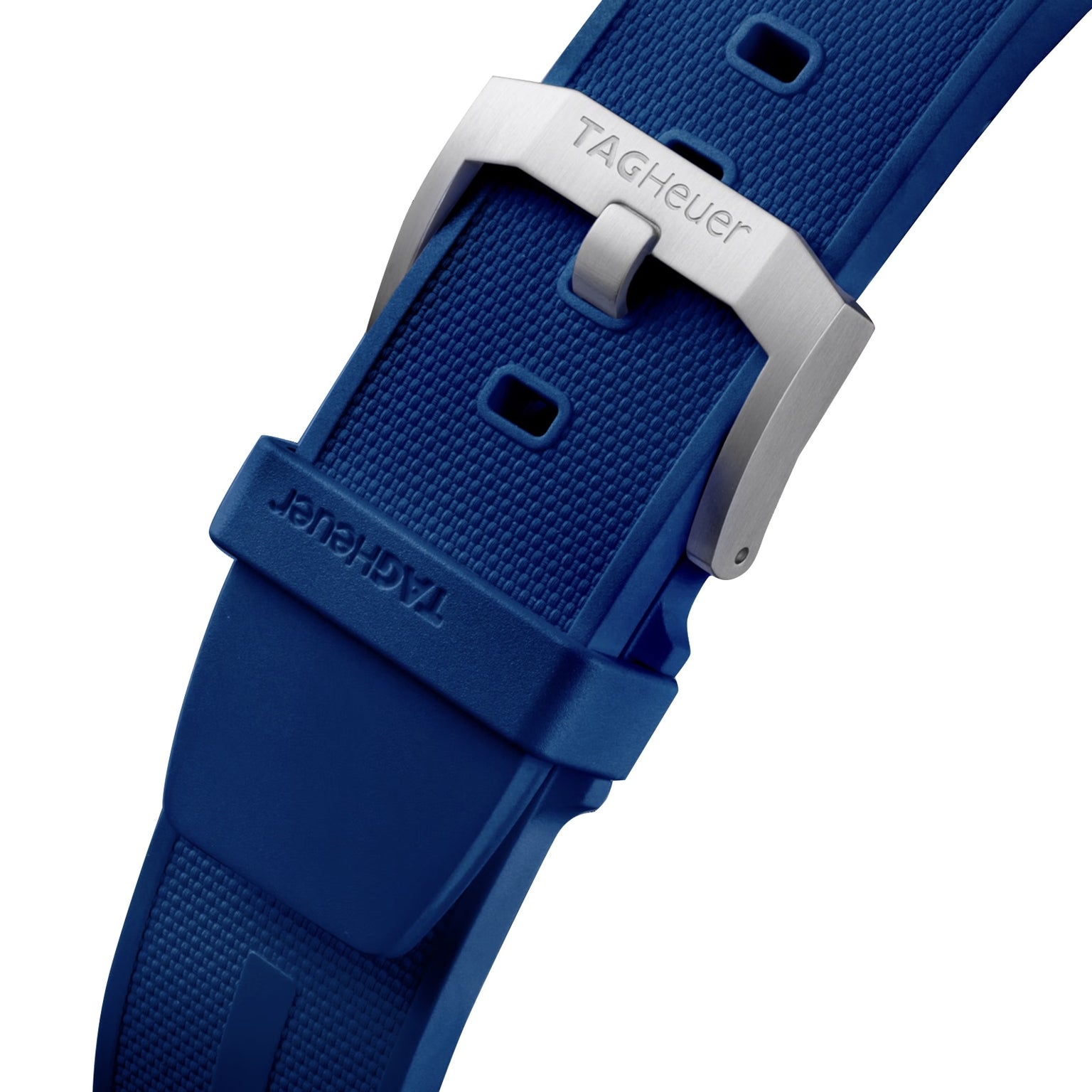 Close-up of a blue textured TAG Heuer Formula 1 Chronograph strap with a silver buckle featuring the TAG Heuer logo, capturing the sporty design of the collection.