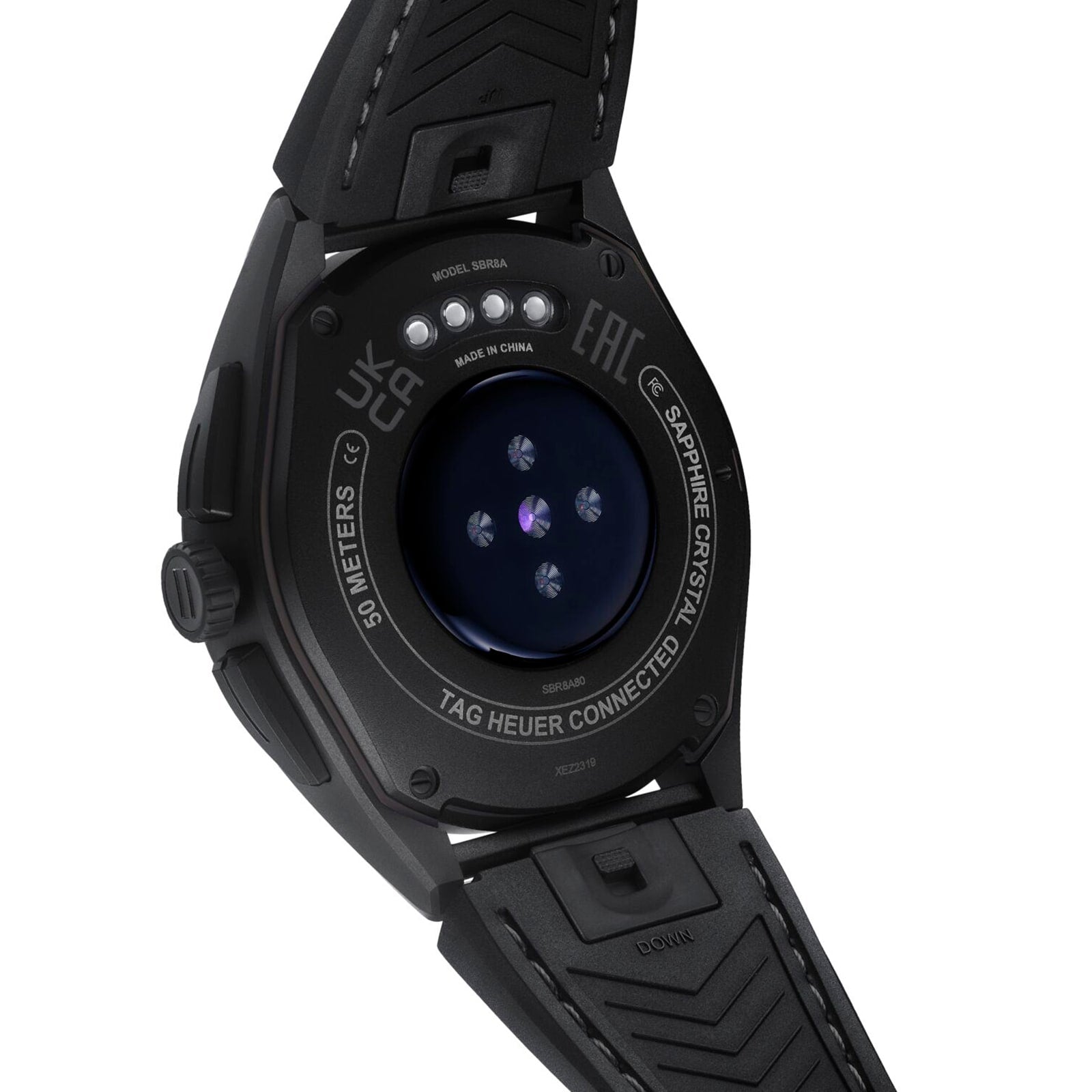 Close-up of the TAG Heuer Special Edition Connected Calibre E4 x Oracle Red Bull Racing Edition smartwatch’s back, showing the team branding, visible sensor, model info, sapphire crystal label, and a rubber strap—ideal for racing watch faces.