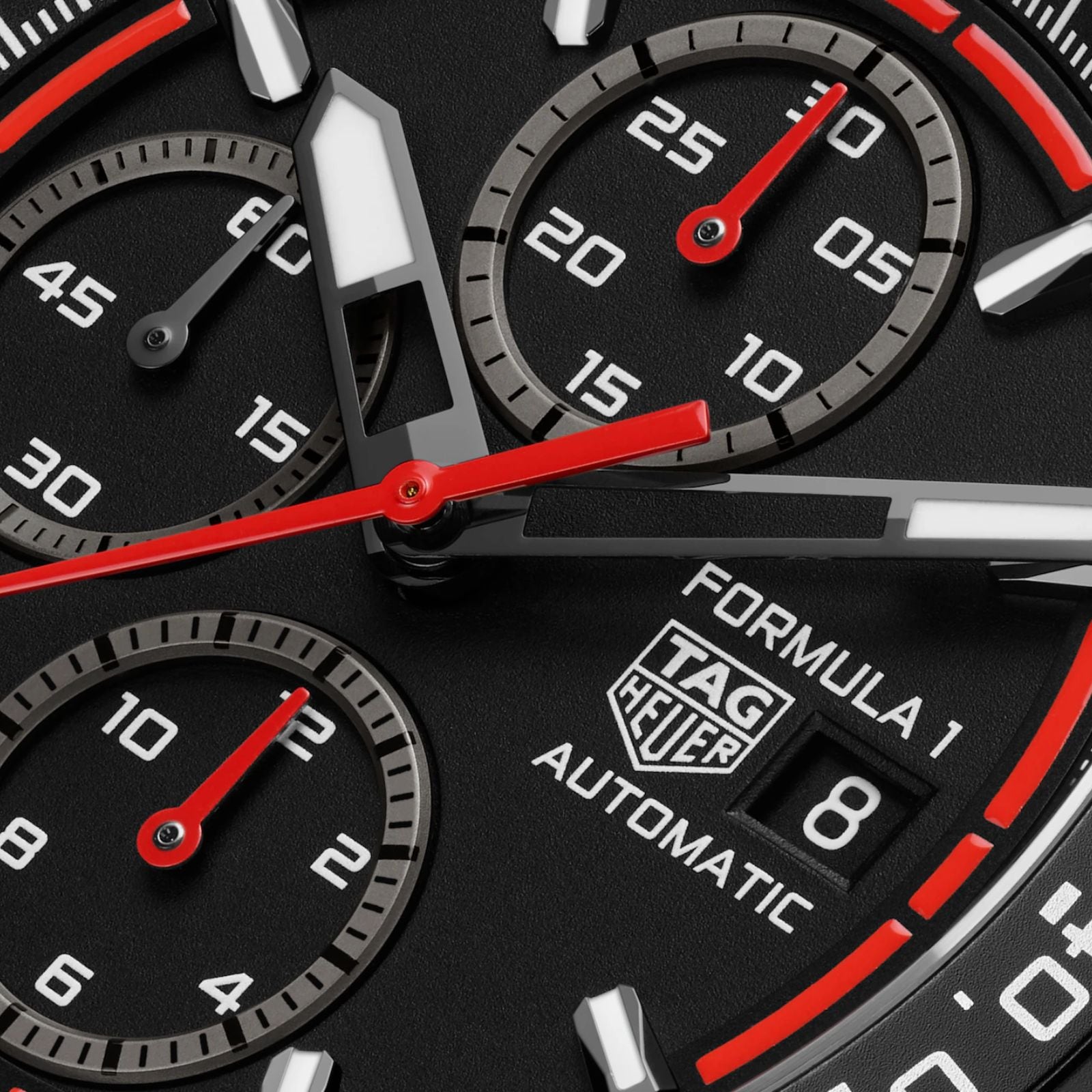 Close-up of the TAG Heuer Formula 1 Chronograph face, featuring subdials, a date window, and red-accented hands and markers.
