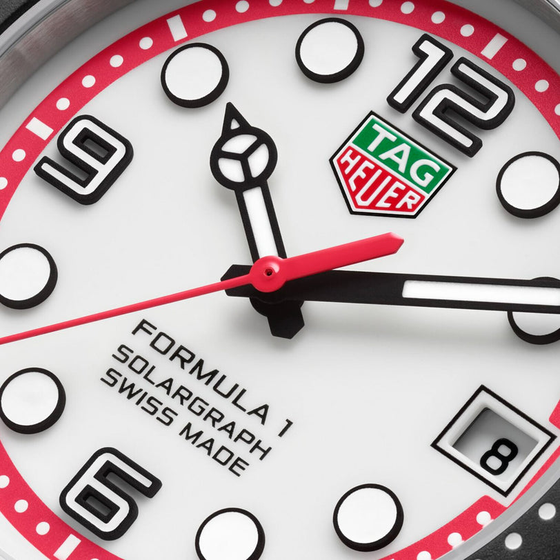 Close-up of a TAG Heuer Formula 1 Solargraph watch face featuring bold numbers and a date window at 3 o’clock.