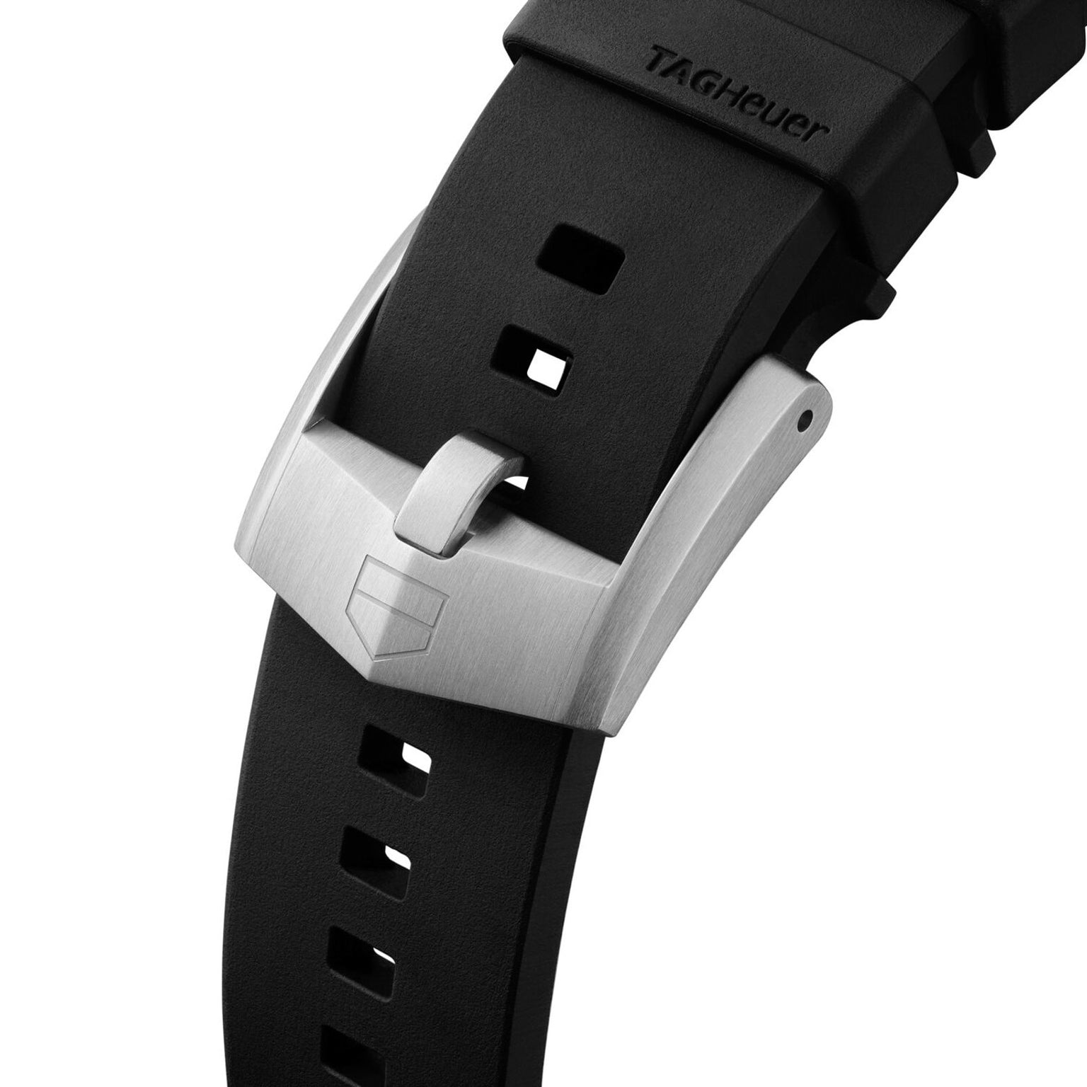 Close-up of a black TAG Heuer Formula 1 Solargraph watch strap featuring a silver buckle engraved with the TAG Heuer logo.