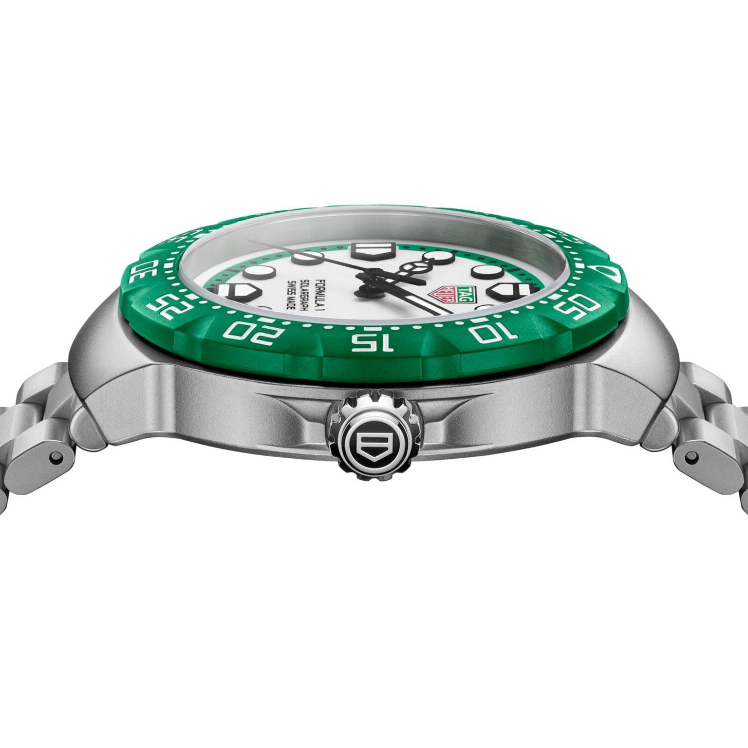 Side view of the TAG Heuer Formula 1 Solargraph, a silver watch with a green bezel, white face, metal bracelet, and crown.
