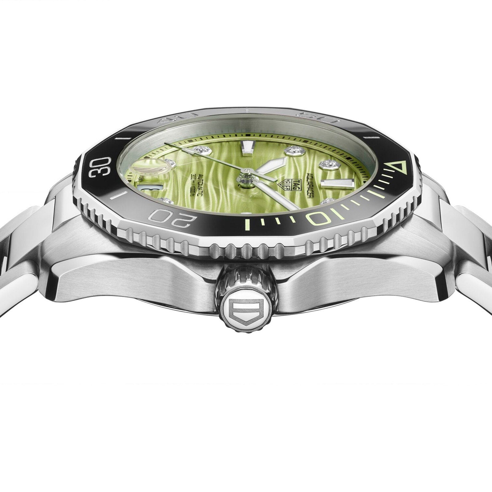 Side view of the TAG Heuer L SS AU BW AQUAR 300 36 GRN DD DL 25, a silver wristwatch featuring a green textured dial and black bezel, shown on a white background.