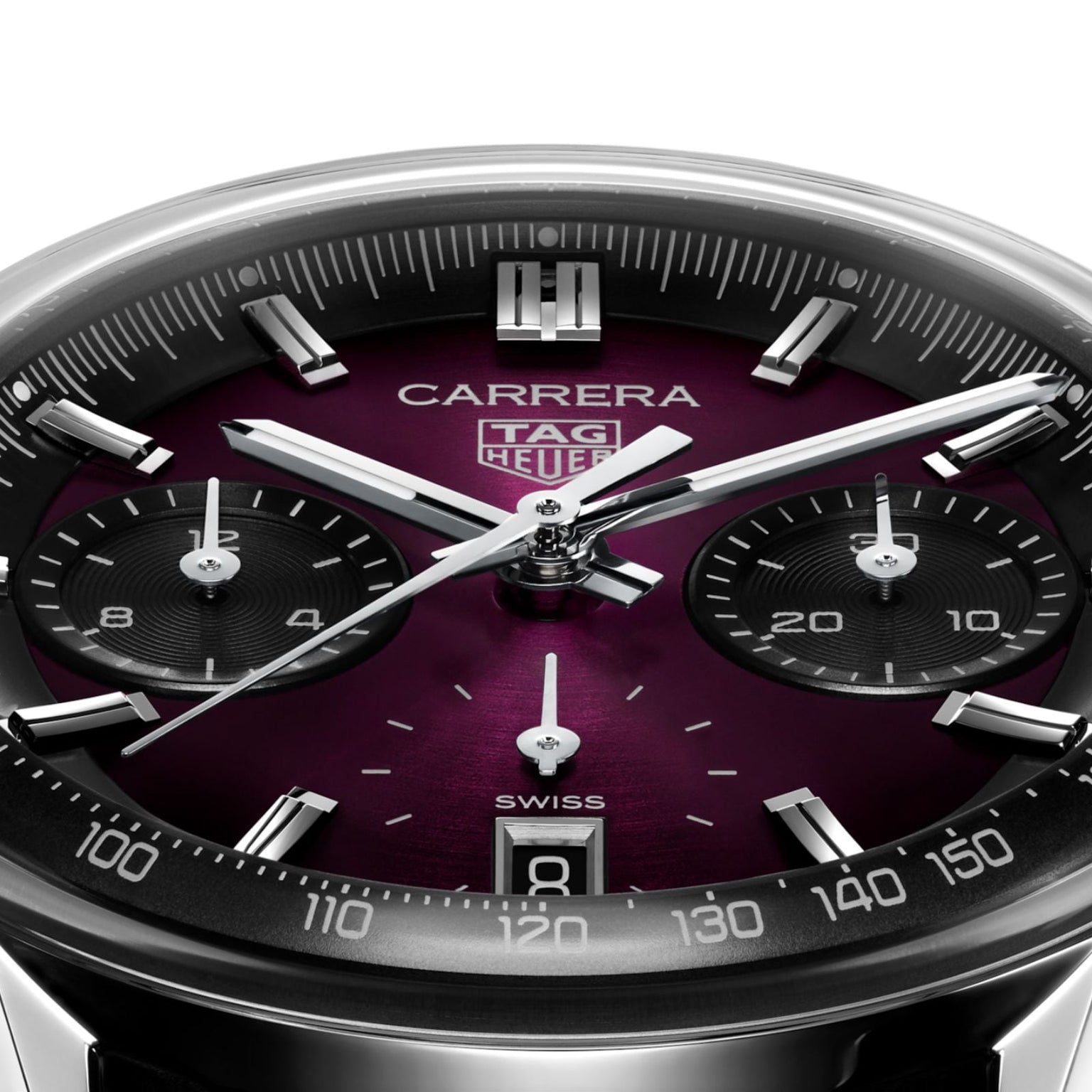 Close-up of a TAG Heuer Carrera Chronograph watch showcasing a smokey purple sunray brushed dial, three subdials, date at 6 o’clock, and sleek silver hands.