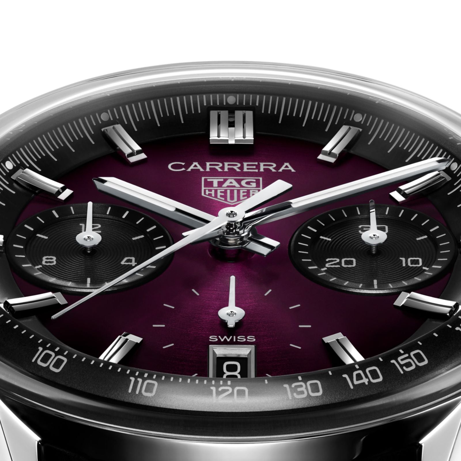 Close-up of a TAG Heuer Carrera Chronograph watch showcasing a smokey purple sunray brushed dial, three subdials, date at 6 o’clock, and sleek silver hands.