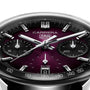 Close-up of a TAG Heuer Carrera Chronograph watch showcasing a smokey purple sunray brushed dial, three subdials, date at 6 o’clock, and sleek silver hands.
