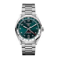 The TAG Heuer Carrera Date Twin-Time features a green dial, silver bracelet, and date display at 6 oclock.