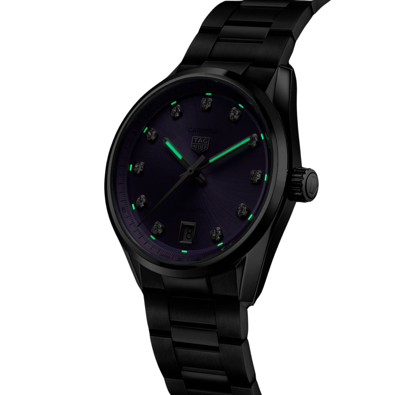 Black TAG Heuer Carrera Date wristwatch with a dark face and green luminous hour markers, displayed at an angle.