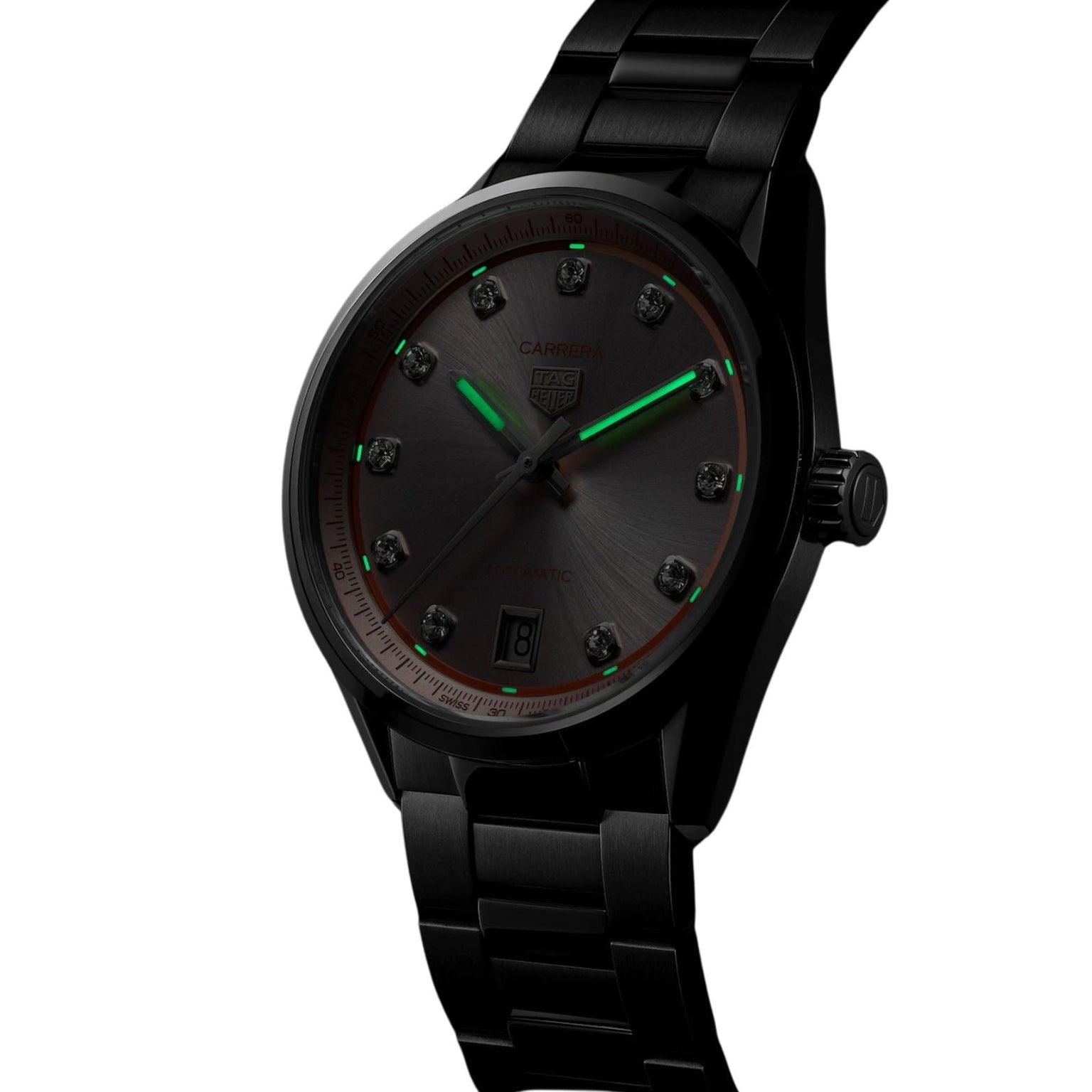 Black TAG Heuer Carrera Date wristwatch with glowing green hands and a dark dial, displayed at an angle.