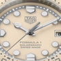 TAG Heuer Formula 1 Solargraph watch face with cream dial, silver hands, round indices, and steel case.