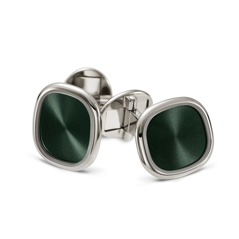 Green cufflinks with silver frame on a white background