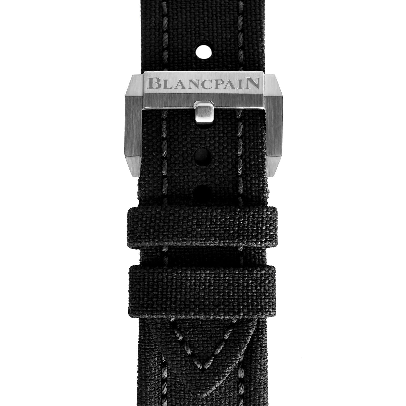 Close-up of a black fabric strap with white stitching and a metal clasp engraved with Blancpain, crafted for the Fifty Fathoms Bathyscaphe Quantième Complet Phases de Lune luxury watch.