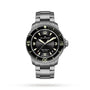 The Blancpain Fifty Fathoms Automatique is an automatic diver’s watch featuring a black dial, luminescent markers, and a date at 4 o’clock, shown on a metal bracelet against a white background. This watch redefines classic dive style.