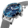 A close-up of the Breitling Superocean Heritage B20 Automatic 46, featuring a blue dial with silver indices, date display, stainless steel mesh bracelet, Breitling B20 calibre movement, and water resistance.