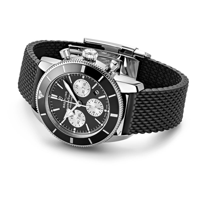 The Breitling Superocean Heritage B01 Chronograph 44 features a stainless steel case, black bezel, black dial with three subdials, date window, and a textured black rubber strap—designed for water resistance and everyday style.