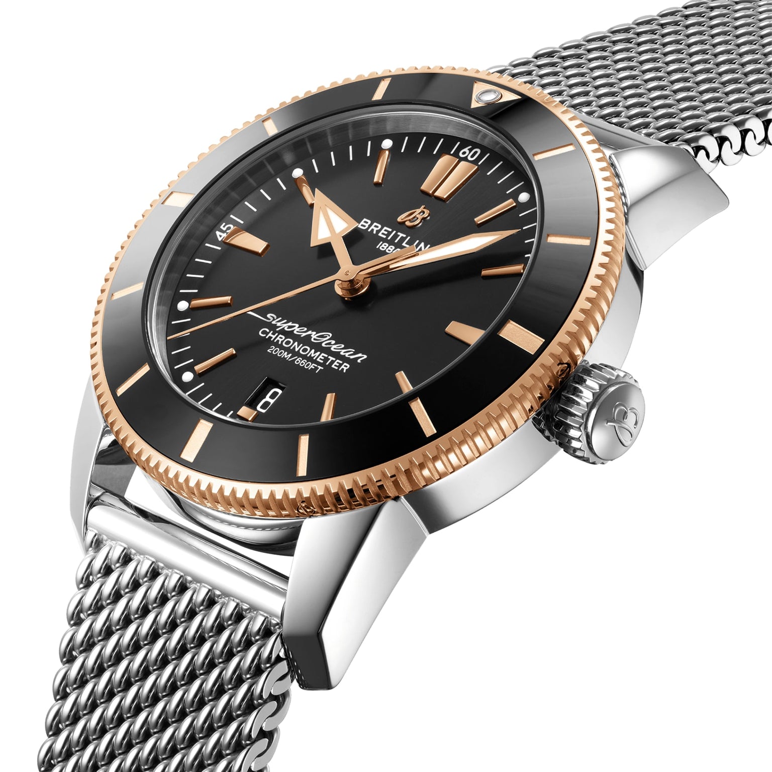 A close-up shows the Breitling Superocean Heritage B20 Automatic 44 watch with a black dial, gold bezel, and silver mesh bracelet.