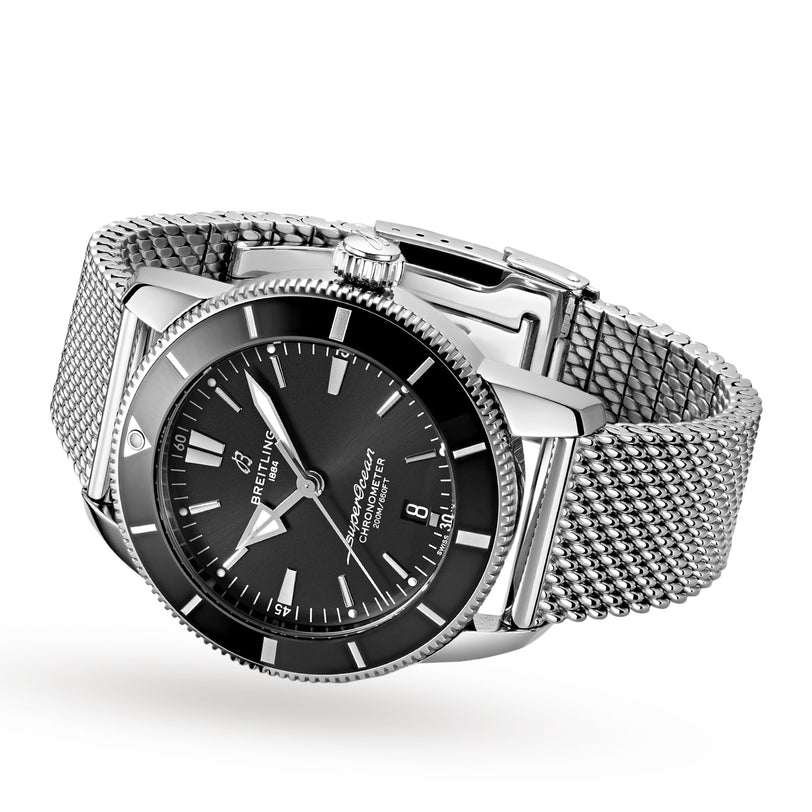 The Breitling Superocean Heritage B20 Automatic 44, featuring a stainless steel case, black dial, date display, and mesh bracelet, is displayed against a plain white background.