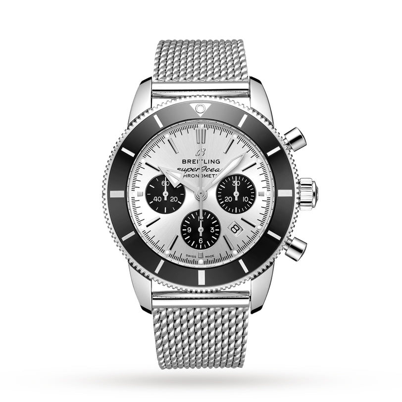 The Breitling Superocean Heritage B01 Chronograph 44 features a silver mesh band, black bezel, and three subdials on a white dial—a stylish, water-resistant watch perfect for any occasion.