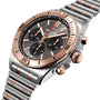 The Breitling Chronomat B01 42 is a stainless steel and rose gold watch with a black dial, three subdials, and a link bracelet.