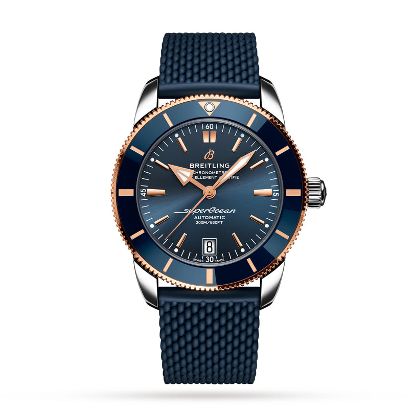 The Breitling Superocean Heritage B20 Automatic 42 watch features a blue dial, 18K red gold case with gold accents, and a blue textured strap, displayed against a white background.