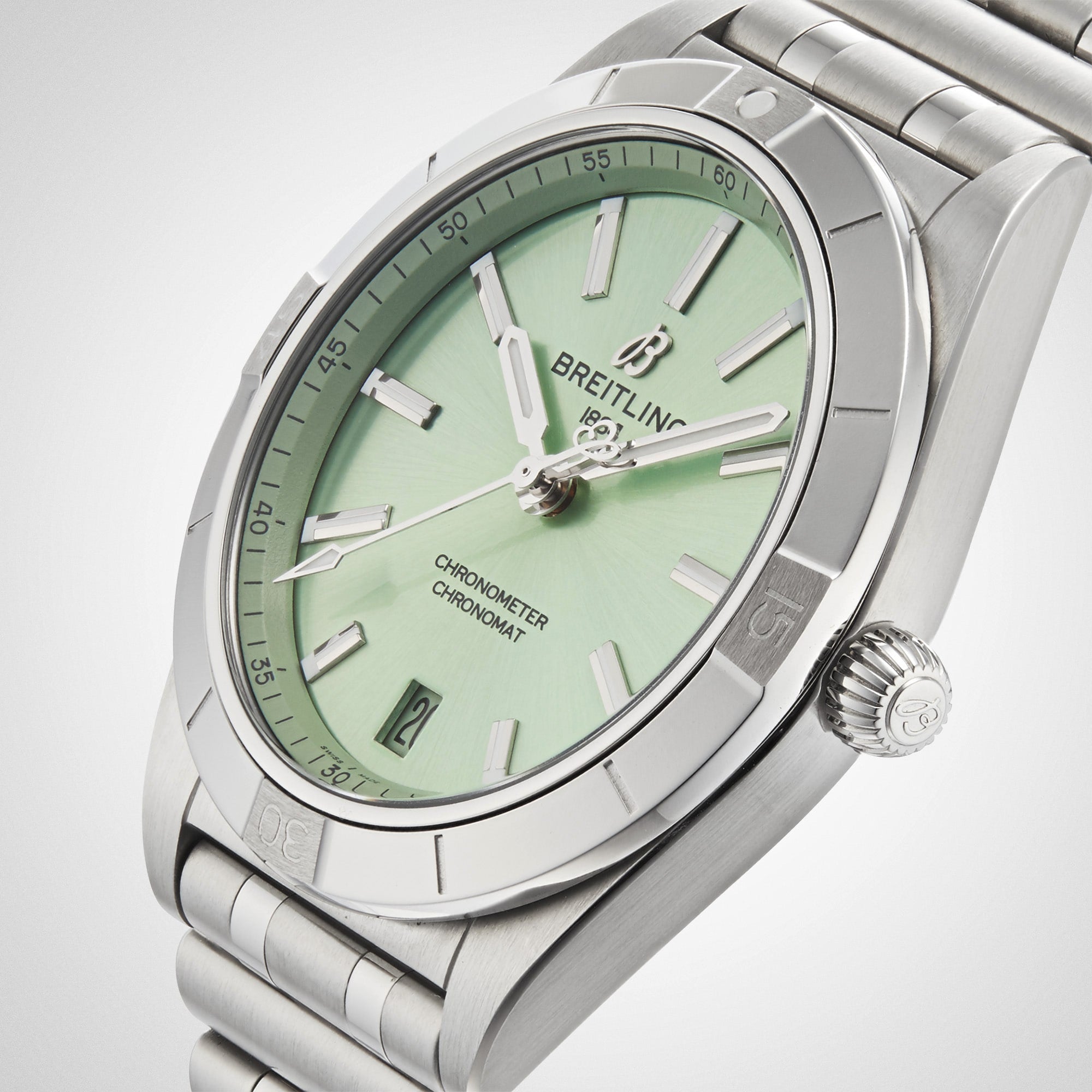 The Breitling Chronomat Automatic 36 features a mint green dial, luminescent hands, date at 6 o’clock, stainless steel case, and signature Rouleaux bracelet.