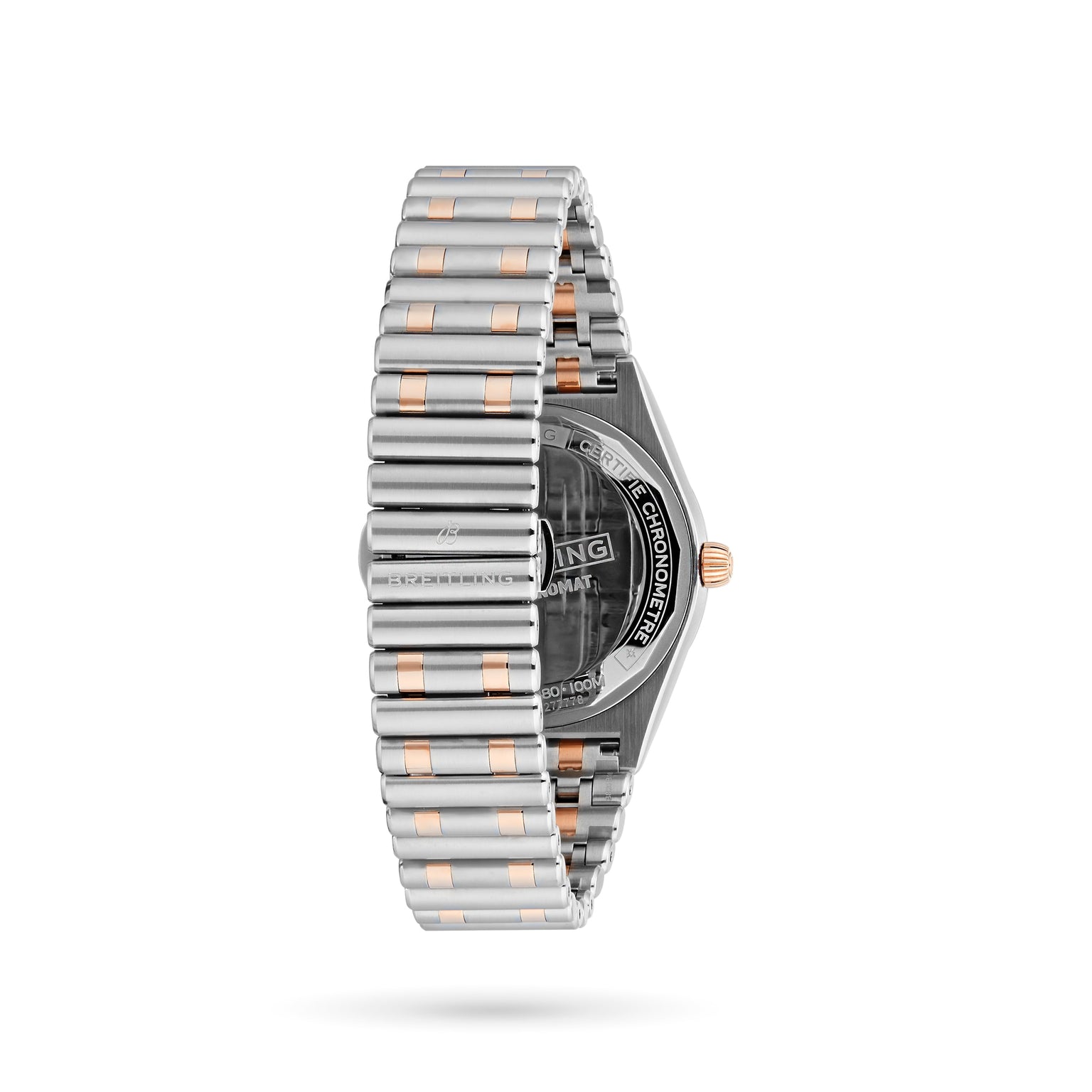 The Breitling Chronomat Automatic 36 is shown from the back at a side angle, highlighting its silver and gold bracelet, partially visible engraved caseback, and elegant diamond-set bezel.