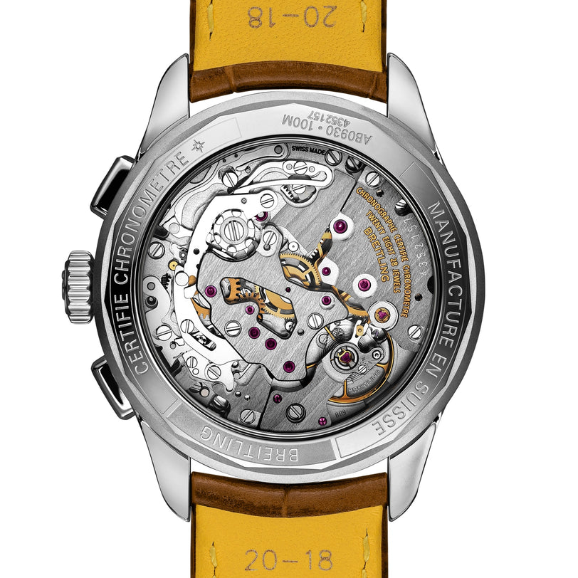 Close-up of the transparent case back of the Breitling Premier B09 Chronograph 40, showcasing the intricate B09 calibre movement and detailed engravings on the metal rim.