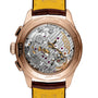 Close-up of the Breitling Premier B09 Chronograph 40, highlighting its intricate mechanical movement and engraved details on the 40mm 18K red gold chronometer-certified case.