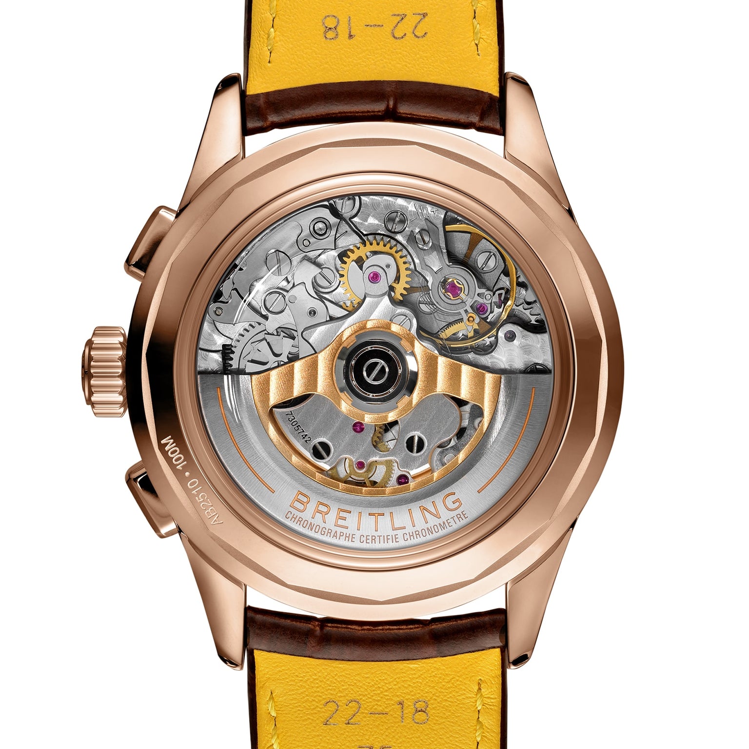 The back view of the Breitling Premier B25 Datora 42 features a transparent case revealing its intricate mechanical movement and inner gears, complemented by a yellow leather strap and an engraved brand label.