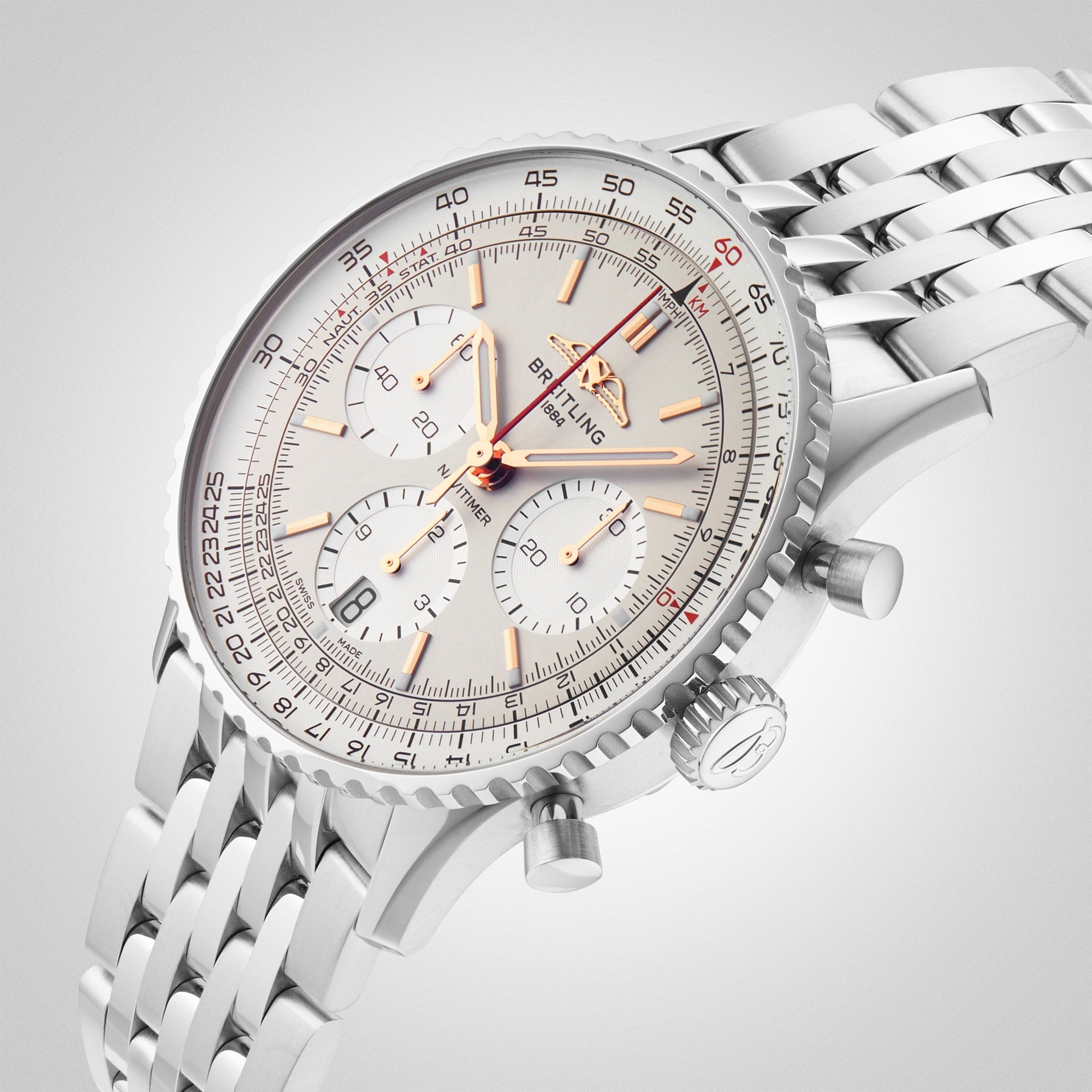 The Breitling Navitimer B01 Chronograph 41 features a white dial, gold-tone hands and markers, three subdials, date display, and a stainless steel link bracelet—an iconic pilot’s watch photographed on a white background.