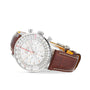 A Breitling Navitimer B01 Chronograph 41 wristwatch features a silver case, white dial with multiple subdials, and a brown leather strap, displayed on a white background.