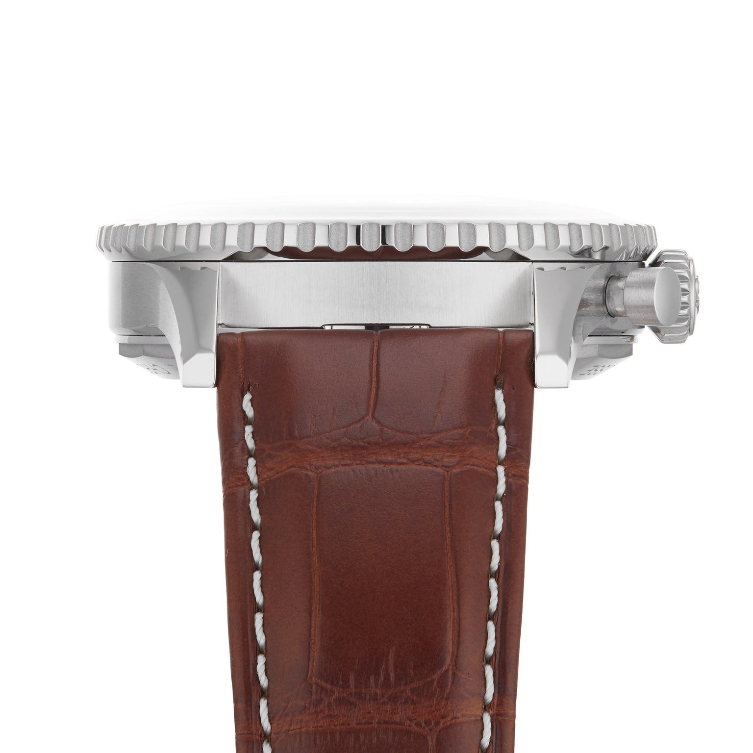 Side view of the Breitling Navitimer B01 Chronograph 41, featuring a silver case, ridged bezel, crown, and a brown leather strap with white stitching.