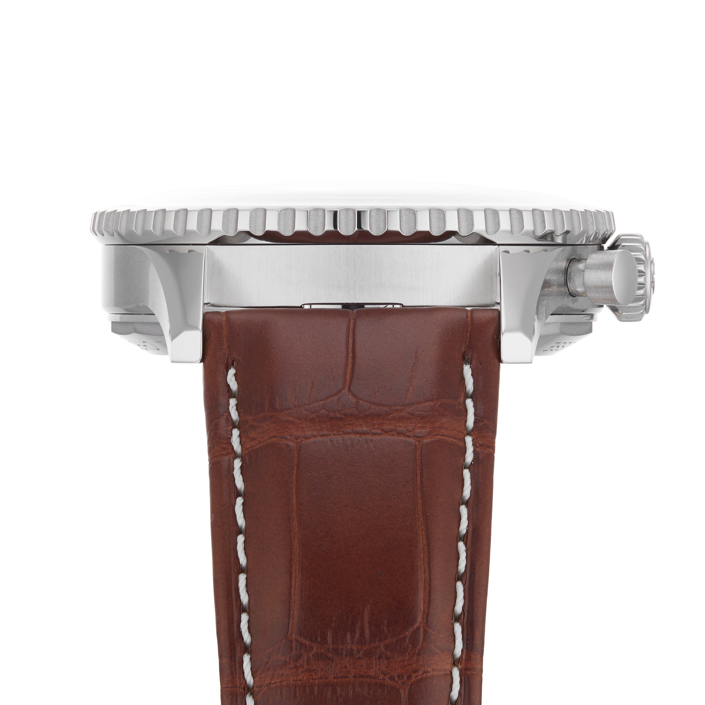 Side view of the Breitling Navitimer B01 Chronograph 41, featuring a silver case, ridged bezel, crown, and a brown leather strap with white stitching.