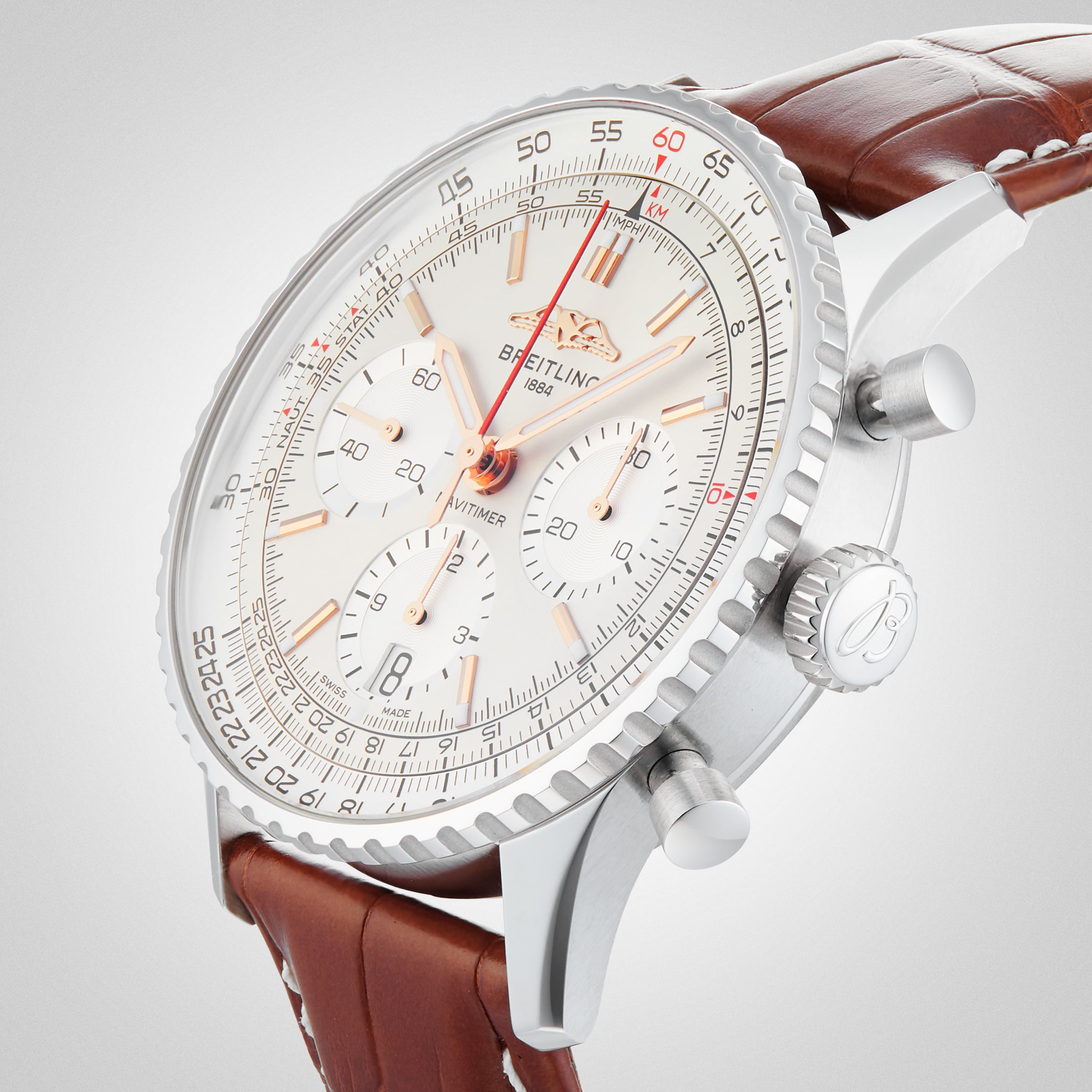 A close-up of the Breitling Navitimer B01 Chronograph 41 wristwatch, featuring a brown leather strap, silver case, and a detailed white dial with multiple subdials and precise chronograph markings.