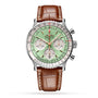 A Breitling Navitimer B01 Chronograph 41 wristwatch with a silver case, mint green dial, three subdials, and a brown leather strap, displayed on a white background.