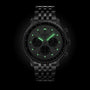 The Breitling Navitimer B01 Chronograph 43 is a black metal wristwatch with luminescent green hour markers and hands, precision chronograph, shown against a black background.