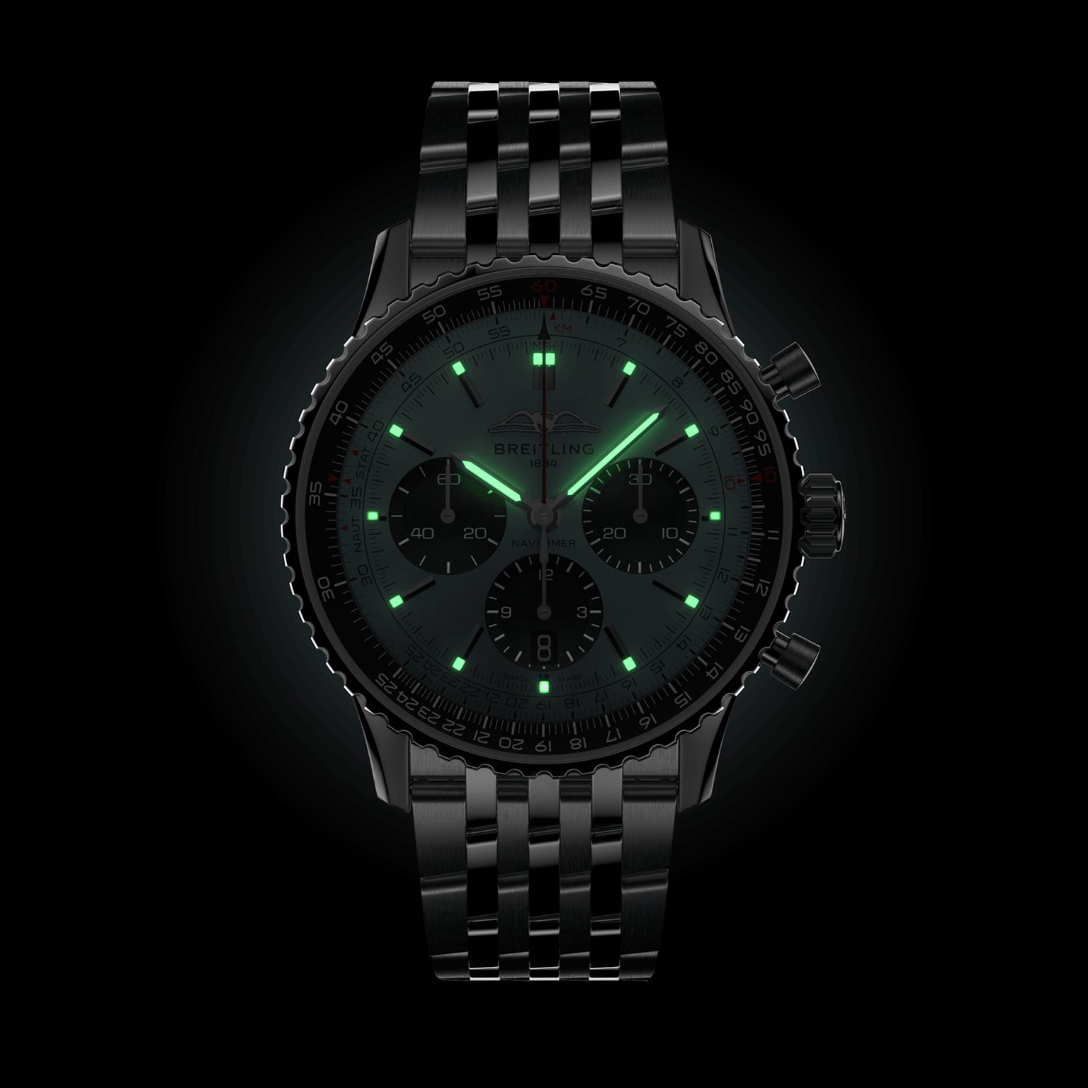 The Breitling Navitimer B01 Chronograph 43 is a black metal pilot’s watch with a chronograph display, glowing green hour markers and hands, powered by the Breitling 01 calibre, shown against a black background.