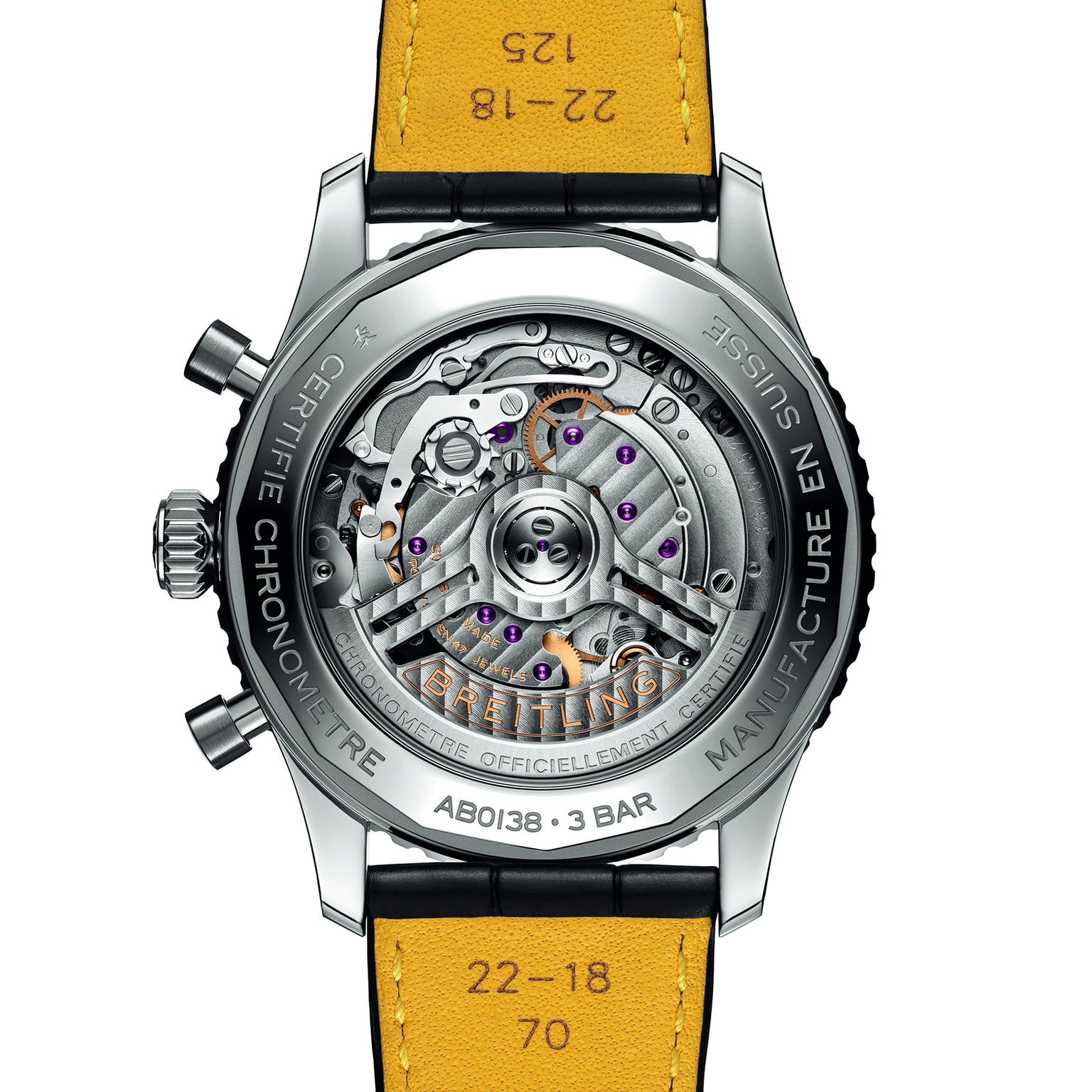 Close-up of the back of a Breitling Navitimer B01 Chronograph 43, revealing its exposed mechanical movement, labeled parts, and a yellow leather strap marked with printed numbers.