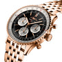 The Breitling Navitimer B01 Chronograph 43 has a rose gold case, black dial with three subdials, date window, metal link bracelet, and is powered by the Breitling 01 calibre.