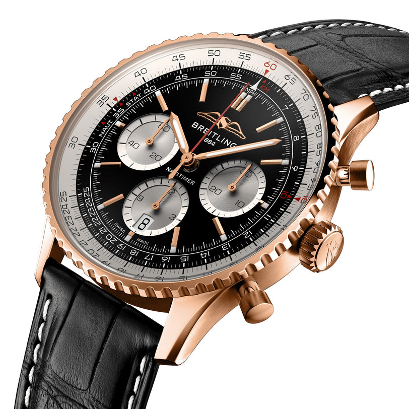 Close-up of the Breitling Navitimer B01 Chronograph 43, featuring a rose gold case, black dial with three subdials, and a black leather strap.