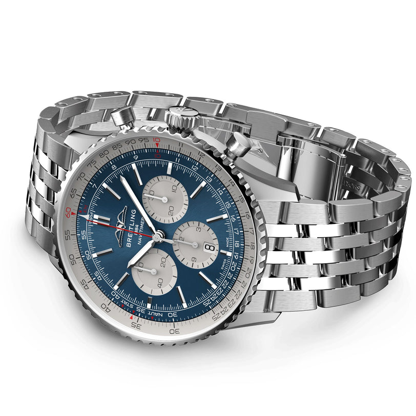 The Breitling Navitimer B01 Chronograph 46, a stainless steel wristwatch with a blue dial, three subdials, silver hour markers, and a linked metal bracelet, is displayed on a white background.