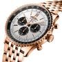 A close-up of the Breitling Navitimer B01 Chronograph 46 in rose gold, featuring a silver dial, black subdials, matching metal bracelet, and the renowned Breitling 01 calibre.