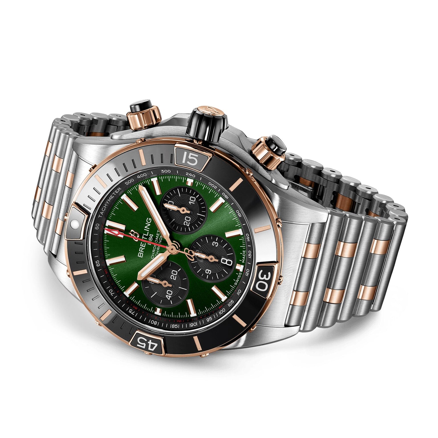 The Breitling Super Chronomat B01 44 is a luxury chronograph watch with an emerald dial, gold and black bezel, three subdials, a two-tone silver and gold metal bracelet, and the renowned Breitling Manufacture 01 Movement.